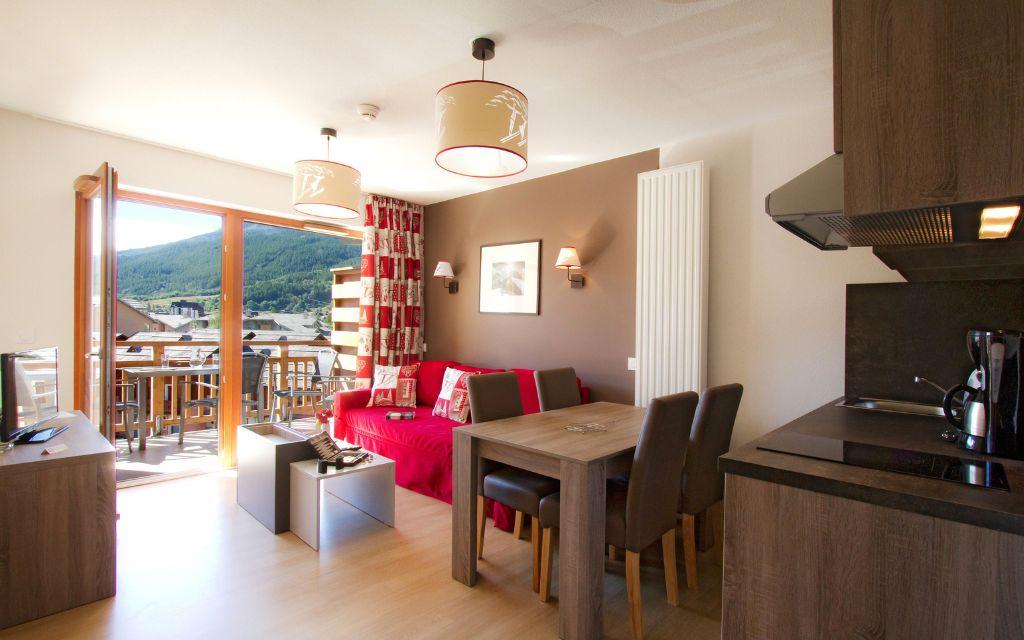 Slide Living area with dining space and open kitchen at the Aquisana residence