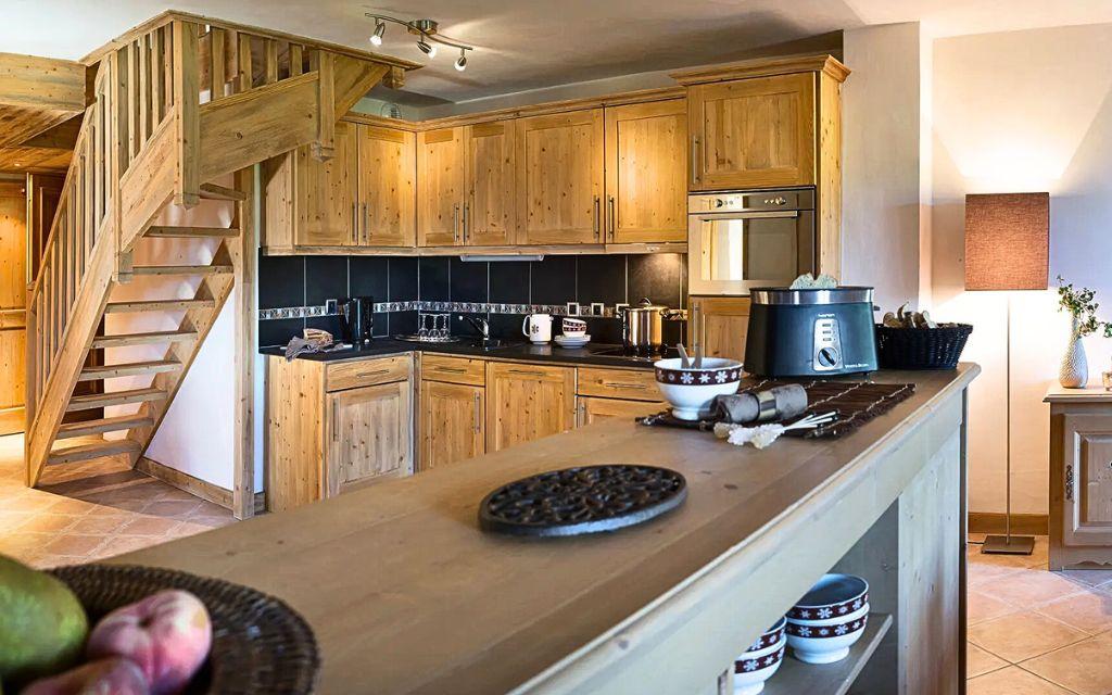 Slide Equipped kitchen open to the living room at the Le Village de Lessy