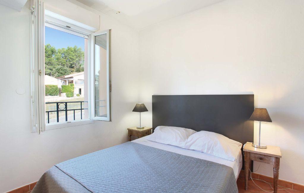 Slide Bedroom with double bed and two bedside tables in an apartment at La Licorne de Haute Provence