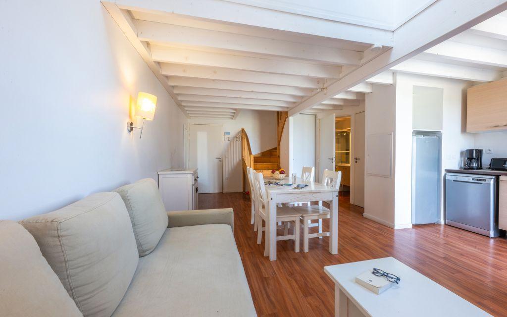 Slide Living room opening onto the lounge and kitchen in one of the Fleur de Sel residence's accommodation units