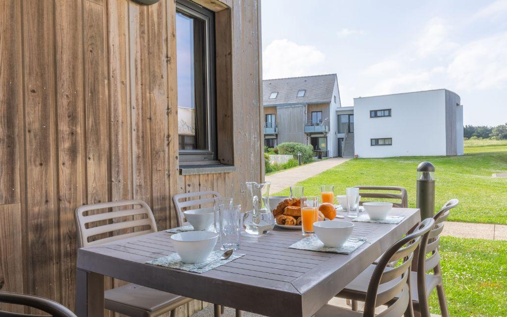 Slide Outdoor terrace at the Fleur de Sel residence with garden furniture