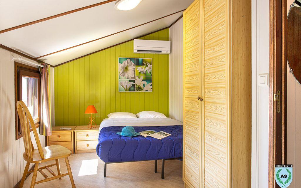 Slide Chambre double avec climatisation dans une maison prestige de la résidence les tamaris et les portes du soleil