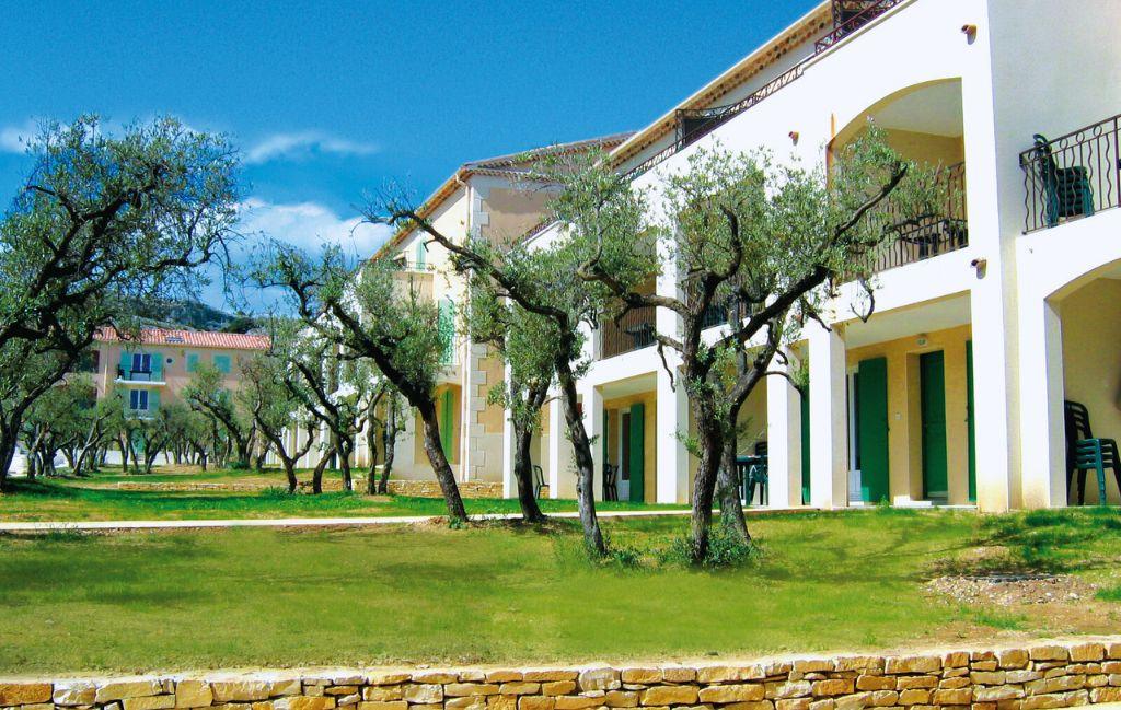 Slide Exterior façade of the Bourgeac estate residence with olive trees