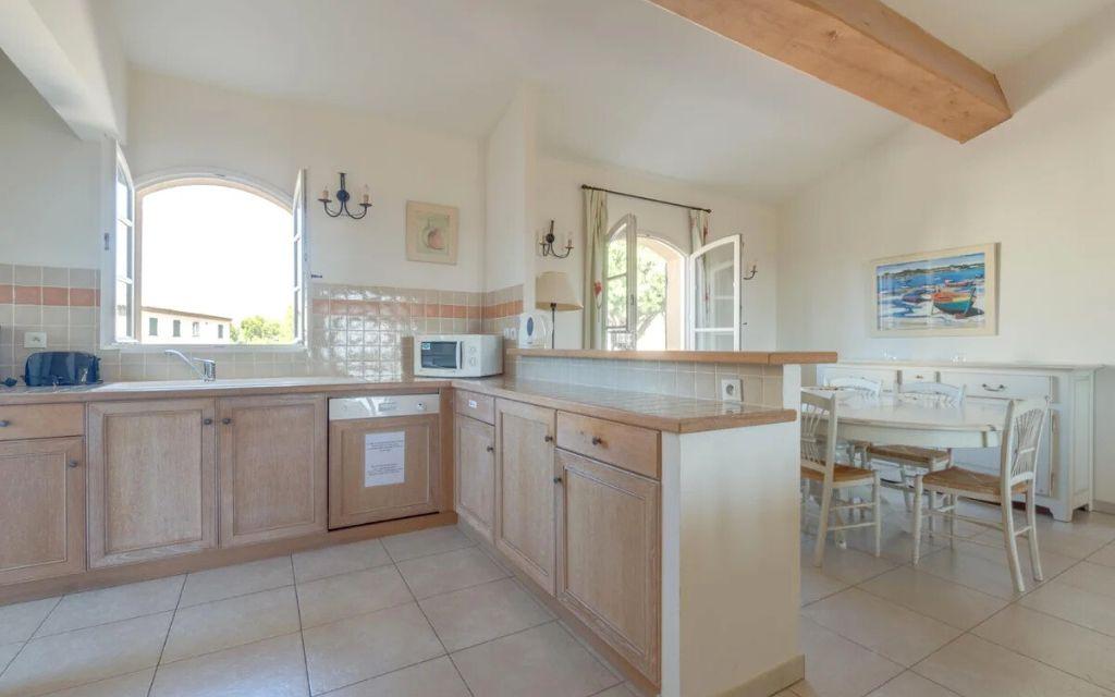 Slide Functional, fully equipped kitchen open to the living area in a typical apartment at Domaine de Saint-Endréol Golf & Spa Resort in La Motte-en-Provence