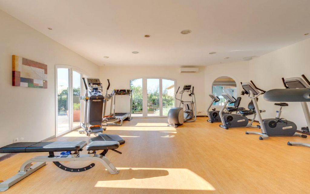 Slide Fitness room with cardio machines at Domaine de Camiole