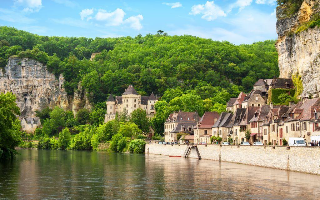 Slide Typical Dordogne village along a river