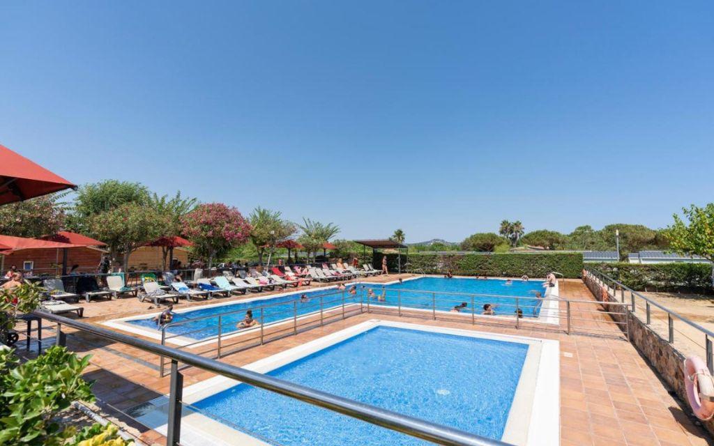 Slide Large uncovered outdoor pool surrounded by sun loungers at Camping del Mar **** in Malgrat de Mar