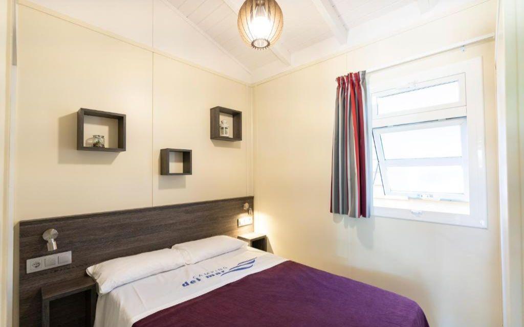 Slide Bright master double bedroom in the Premium Bungalow at Camping del Mar 4* in Malgrat de Mar