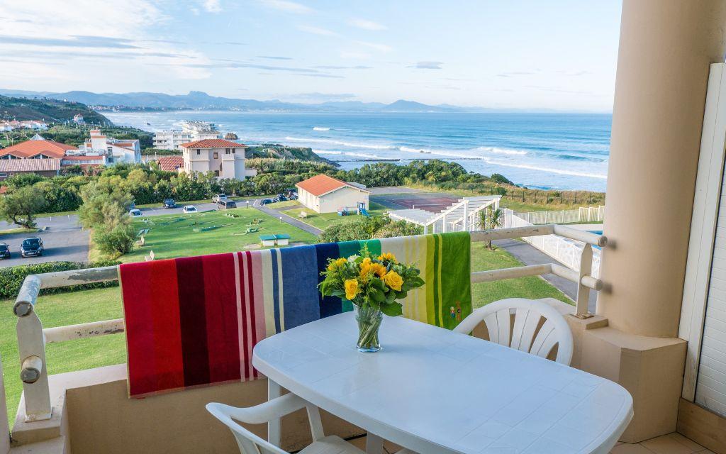 Slide Balcony with outdoor furniture in a studio at the Eugénie residence in Biarritz, with a sea view