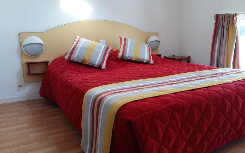 Slide Bedroom with double bed in an apartment at the Ilbarritz residence in Bidart