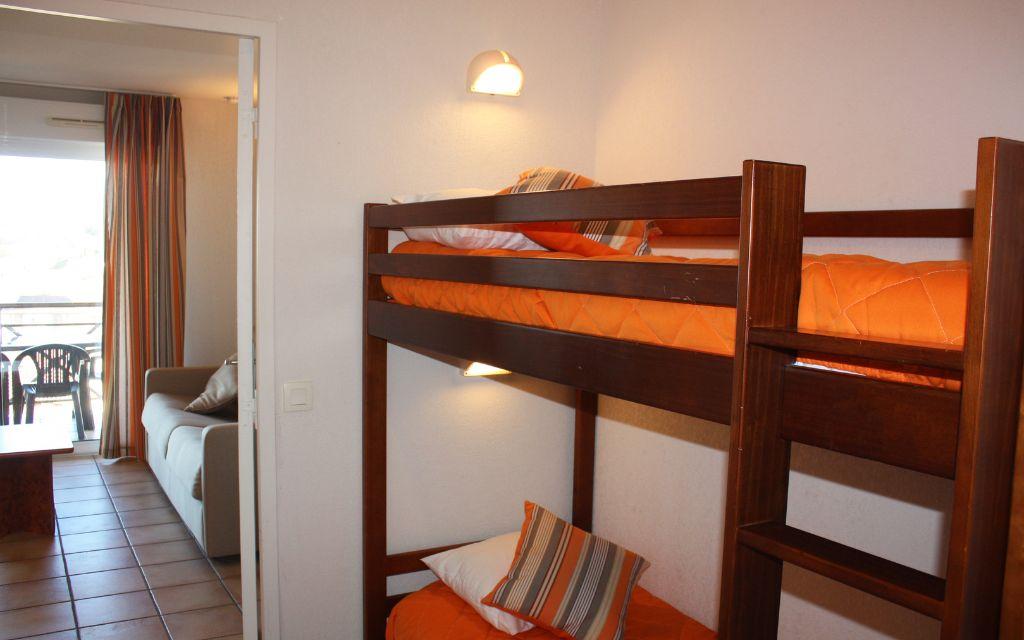 Slide Sleeping area with bunk beds in a 6-person unit at the Soko Eder residence