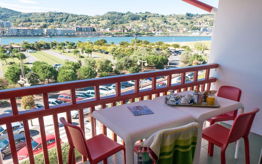 Slide Balcony with outdoor seating overlooking the port from an apartment in the Sokoburu residence