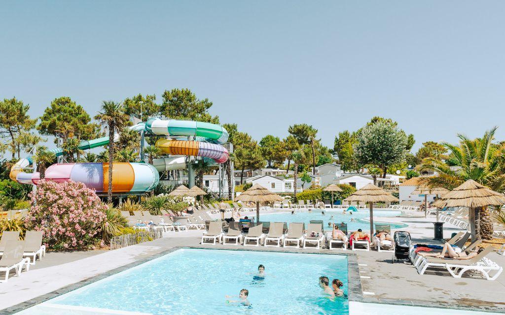 Slide Heated indoor and outdoor pools designed for both children and adults at Tropicana Campsite in Saint-Jean-de-Monts, Vendée