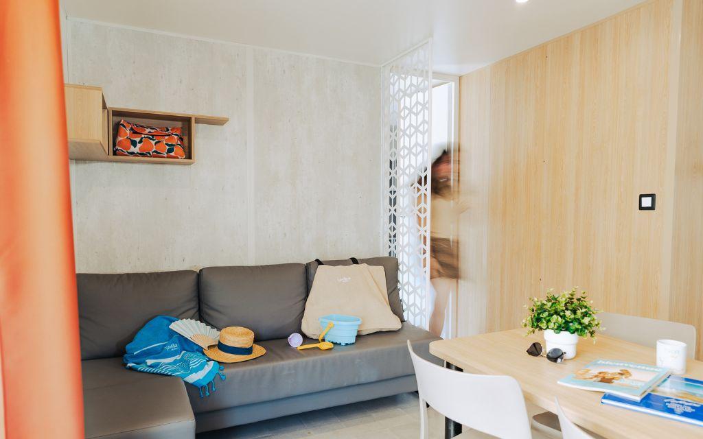 Slide Living area of the Premium 4-person cottage at Les Places Dorées***** campsite