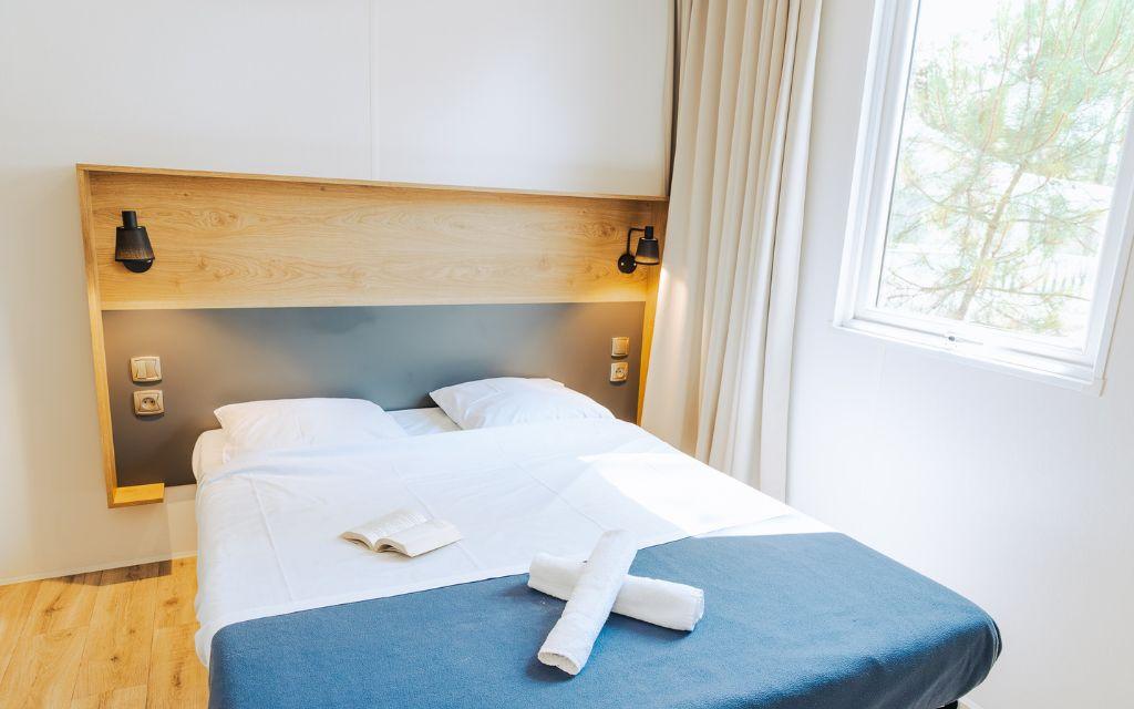 Slide Bedroom for two guests with towels included at Les Places Dorées***** campsite