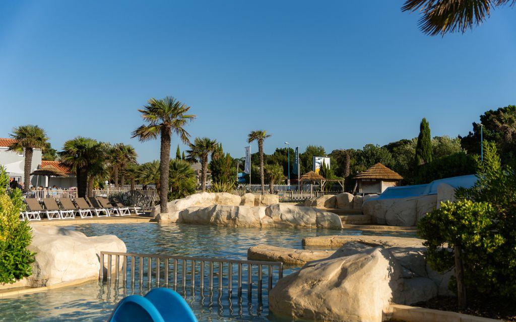 Slide Heated outdoor pool at Les Places Dorées***** campsite