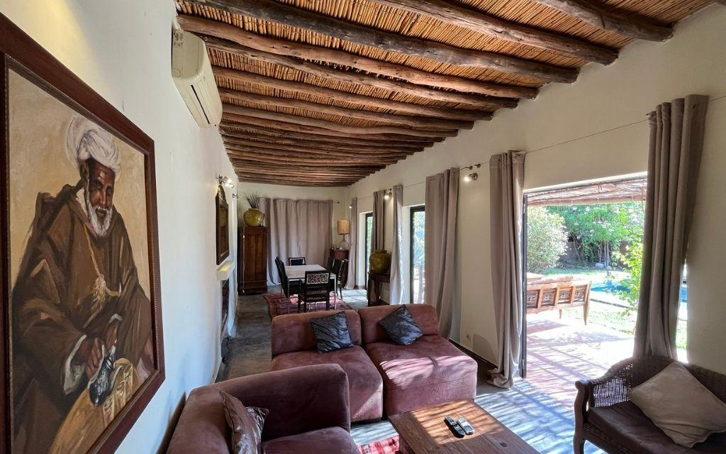 Slide Spacious living room in traditional style, opening onto the large terrace at Villa Dar Wellness