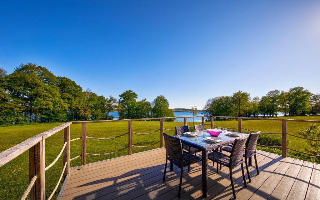 Slide Furnished villa terrace by the lake at Golden Lakes Village Estate