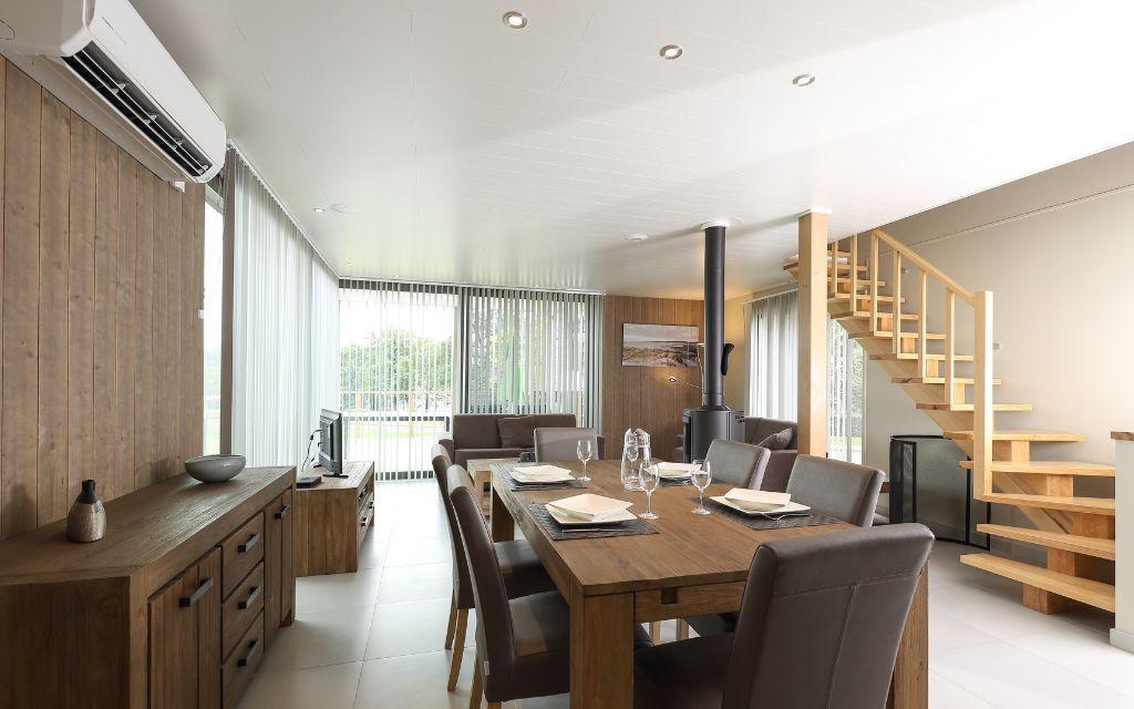 Slide Spacious living room for the whole family with dining area and upper floor at Golden Lakes Village Estate