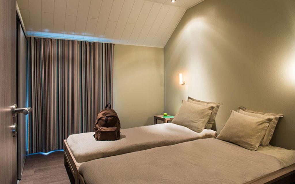 Slide Second bedroom with twin beds at Golden Lakes Village Estate