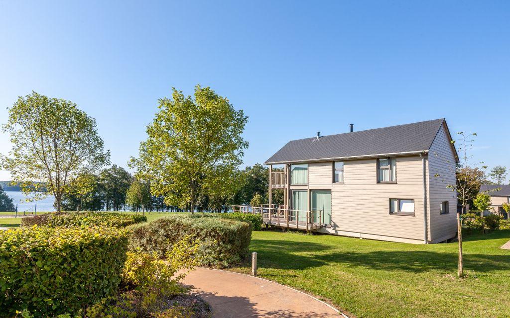 Slide Spacious villa rentals with private garden plots by the lake at Golden Lakes Village Estate in Belgium