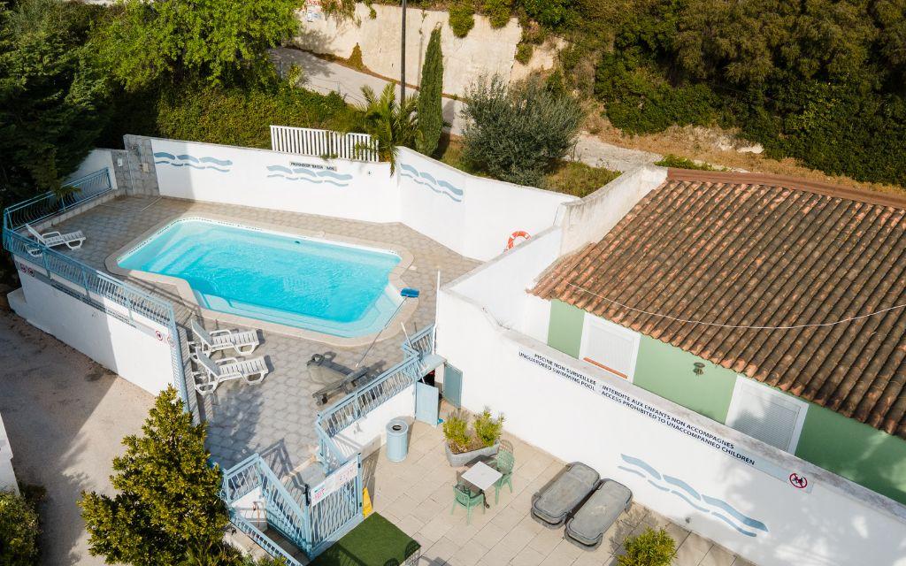 Slide Heated outdoor swimming pool with sun loungers at Résidence Le Saint Estève