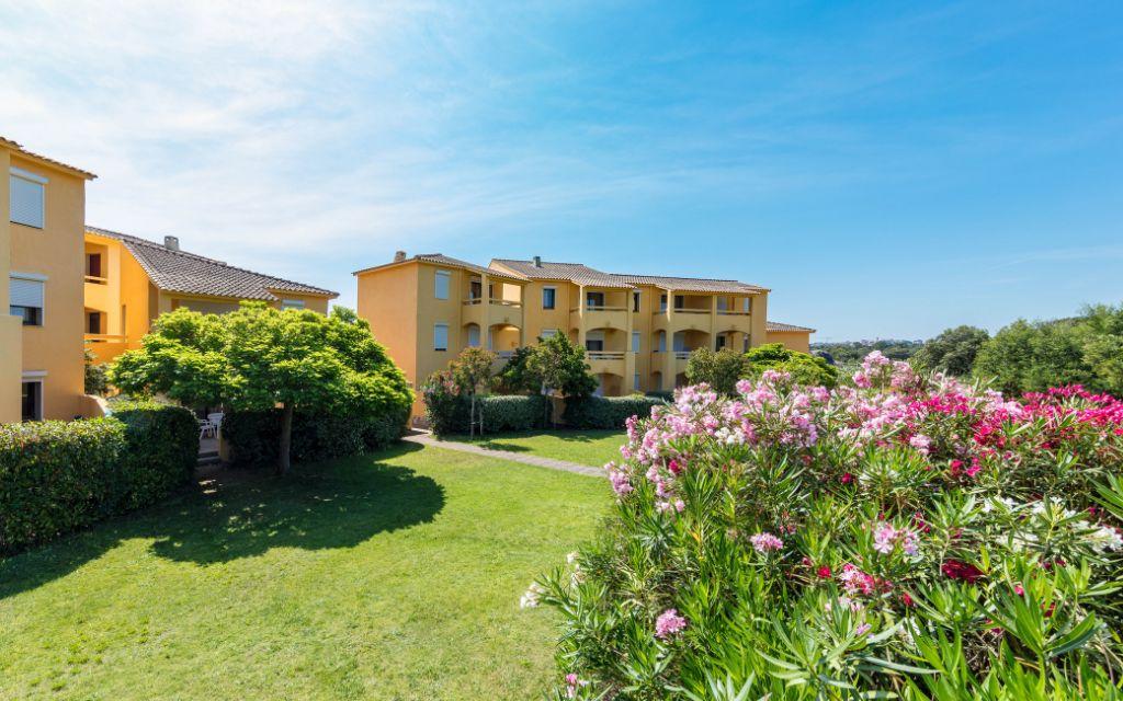 Slide Overview of Paese Serenu Residence in Corsica with landscaped grounds