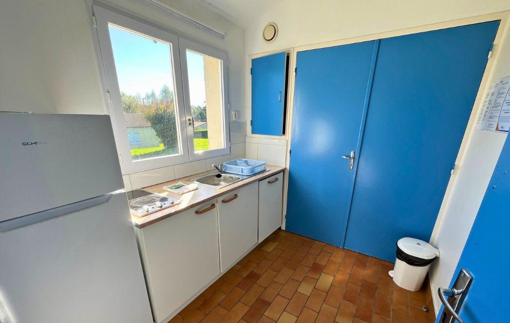 Slide Fully equipped blue kitchen at Le Domaine du Lambon