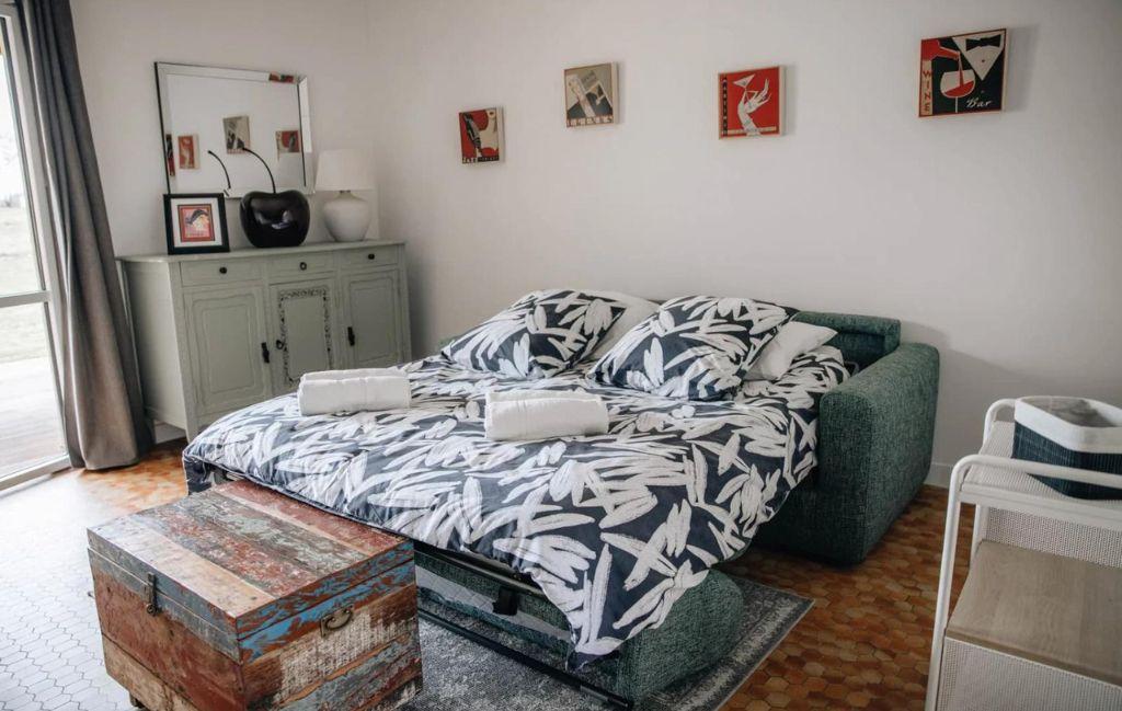 Slide Double sofa bed set up in the living room of a cottage at Le Hameau de Vouvant