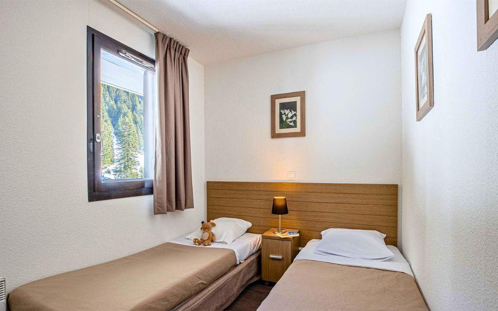 Slide Chambre avec lits simples idéale pour des enfants dans les appartements des Terrasses de Veret à Flaine