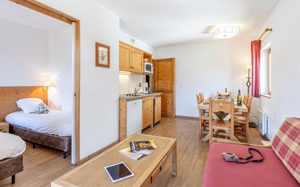 Slide Living room & kitchen at Les Fermes de Saint Sorlin Residence