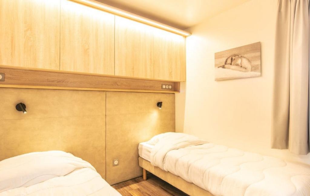 Slide Chambre avec lits simples d'un des logements