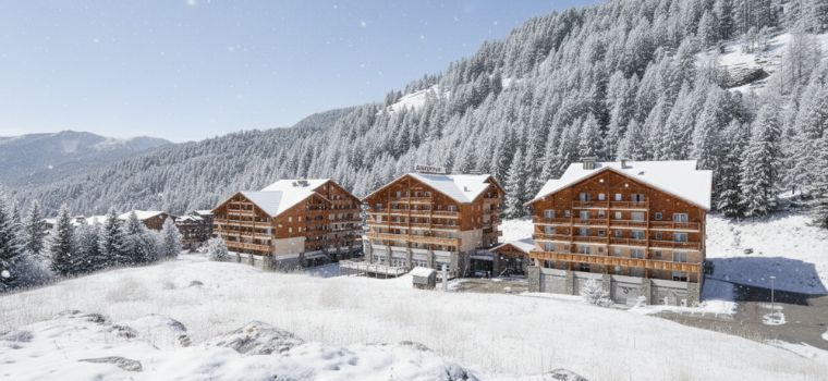 Résidence Les Chalets du Verdon en hiver avec montagnes enneigées