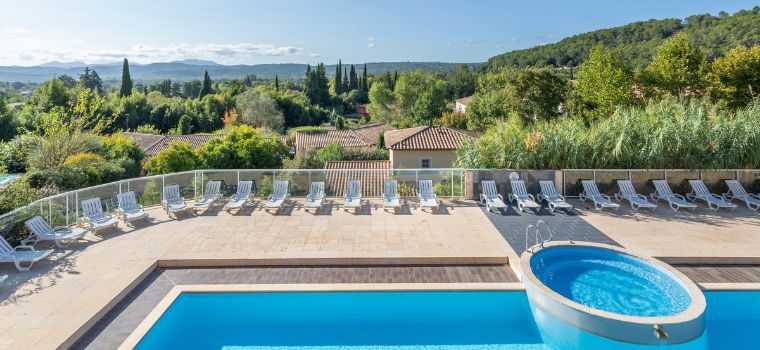 Overview of the upper pool at Domaine de Camiole under the beautiful summer sun
