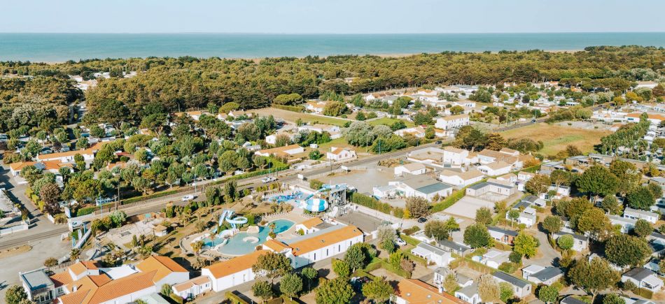 Aerial view of Les Places Dorées***** campsite in Saint-Jean-de-Monts, featuring the water park and slides