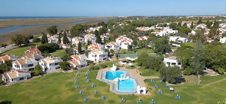 Aerial view of the entire Pedras del Rei estate with accommodation and swimming pool in Santa Luzia, Portugal