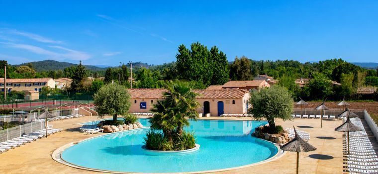 Outdoor water park with bridge at Le Clos des Oliviers residence