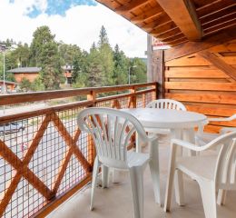 View from a balcony of an apartment in the Pyrénées 2000 residence under the summer sun