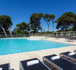 Beautiful swimming pool at the Provence Country Club with sun loungers.