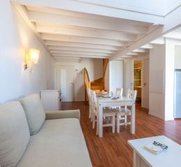 Living room opening onto the lounge and kitchen in one of the Fleur de Sel residence's accommodation units
