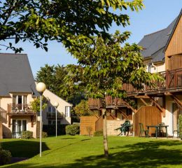 Wooden buildings with gardens at Résidence Les Roches Douvres in Saint-Briac-sur-Mer