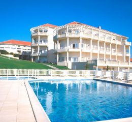 View of the Eugénie residence in Biarritz with the outdoor pool in the foreground