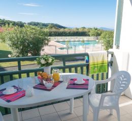 Balcony of an apartment at the Ilbarritz residence in Bidart with pool and sea view