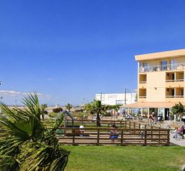 Exterior façade of the Neptune residence with direct access to the beach.