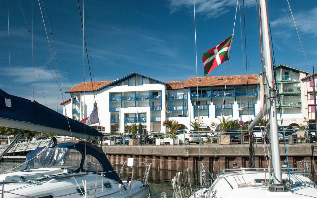 Slide Exterior façade of the Sokoburu residence in Hendaye overlooking the port under a beautiful blue sky