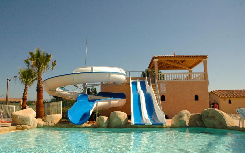 Slide Large outdoor swimming pool with slide at Le Clos des Oliviers residence