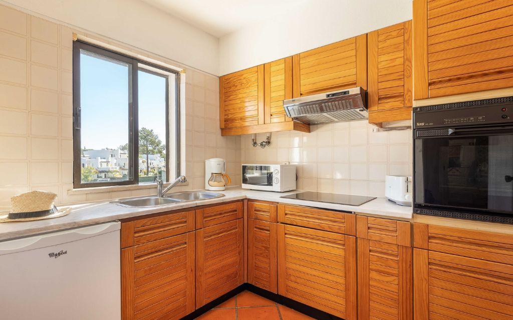 Slide Fully equipped and functional kitchen in the standard accommodations at Balaia Golf Village