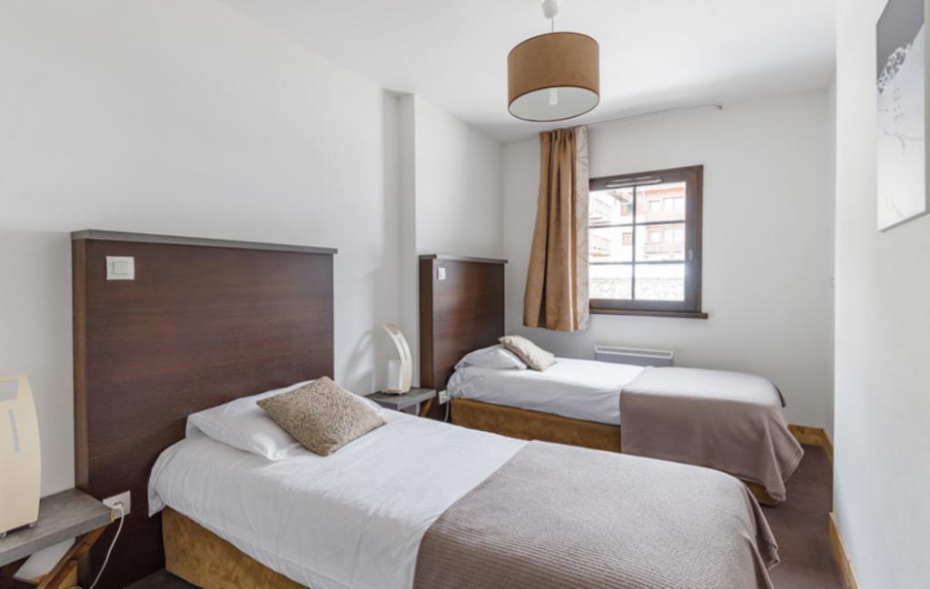 Slide un exemple de chambre avec 2 lits simples